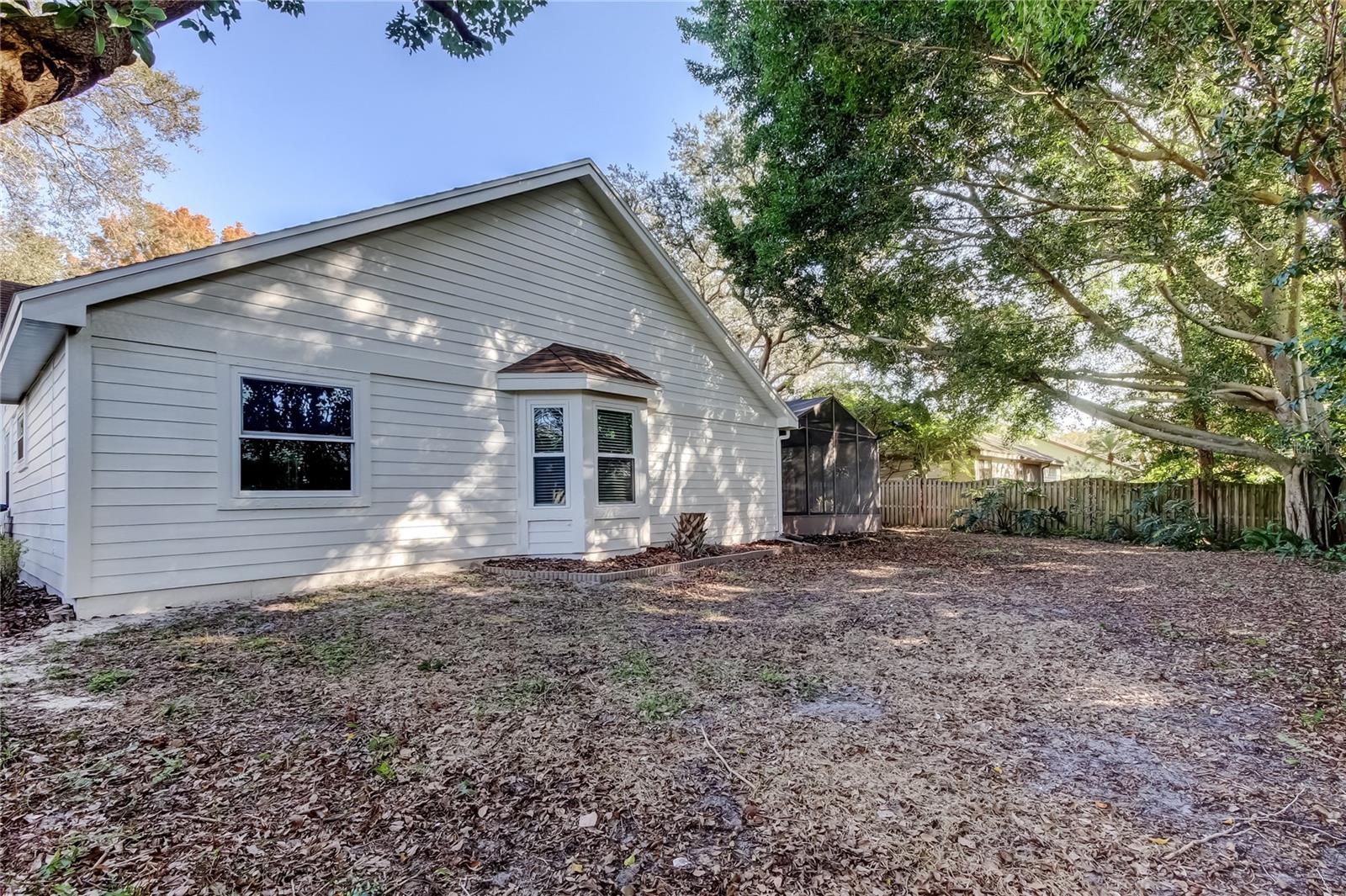 51. Rear View  of Home - Kitchen Bay Window, Bedroom #3 Windows..