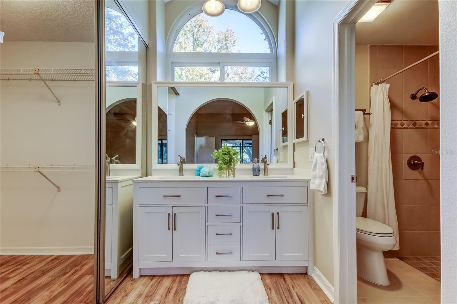 31. Primary Bathroom w Dual Sink Vanity, Arched Clerestory Windows Allows Light in w Privacy! (6.3 ft x 12 ft)!