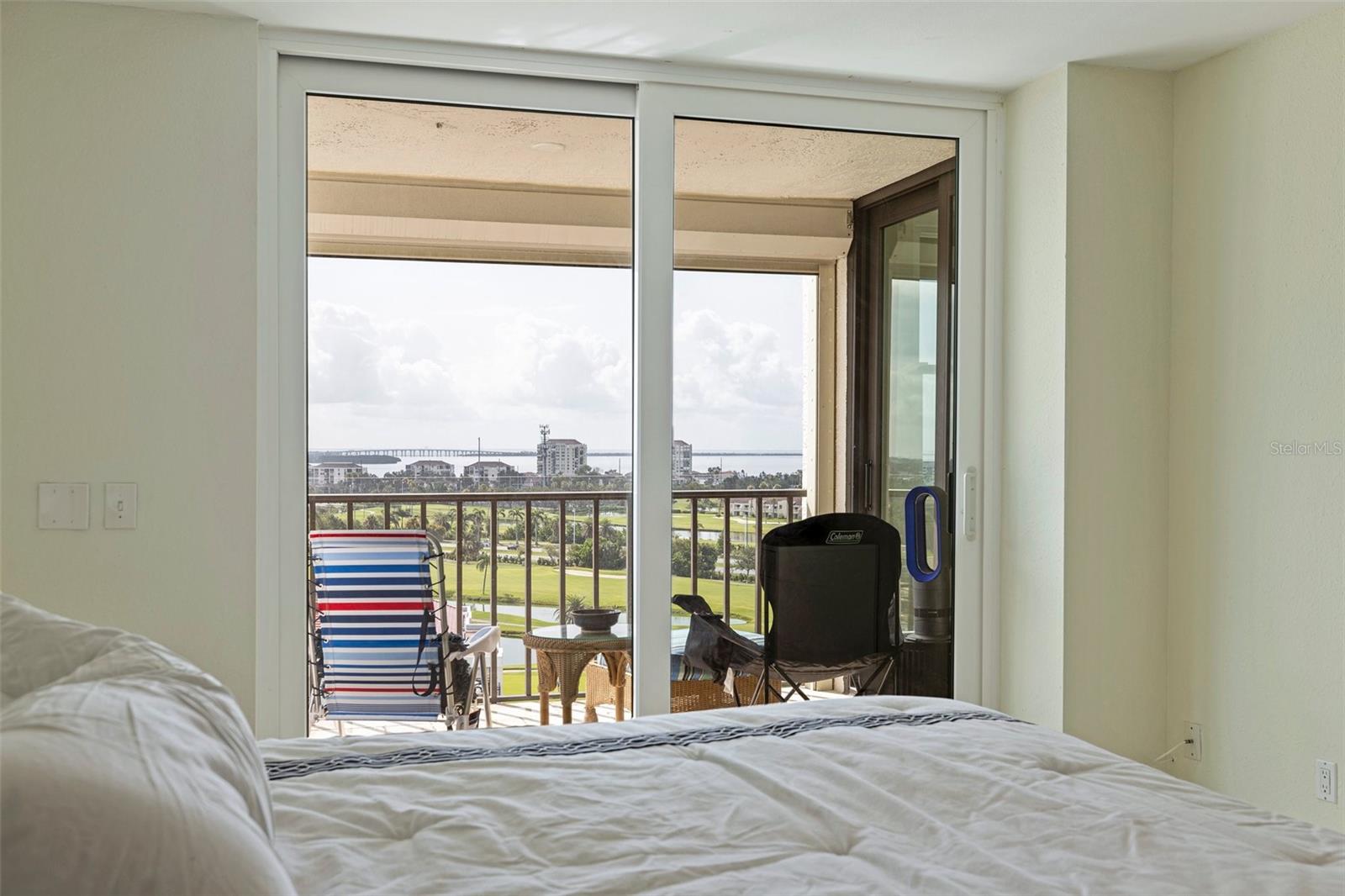 VIEW FROM PRiMARY BEDROOM OVERLOOKING THE ISLAND, GOLF COURSE AND BAY
