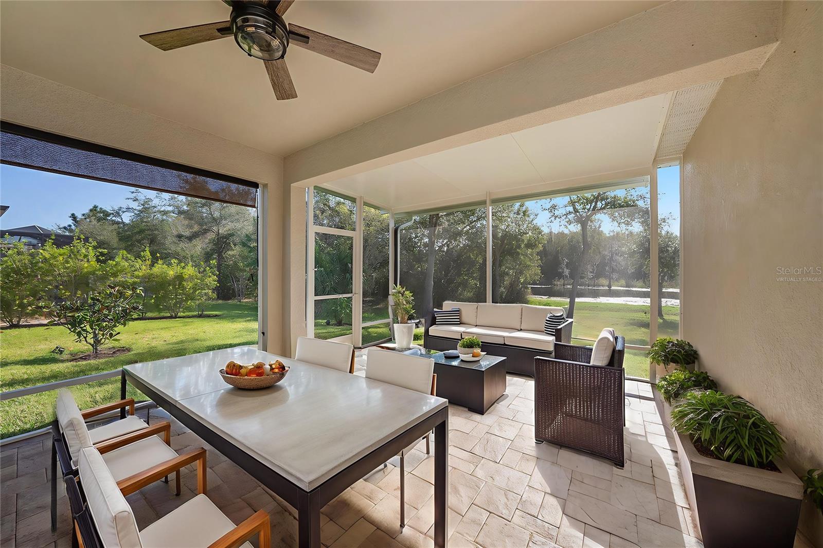 Virtually Staged Photos - Large Lanai overlooking pond