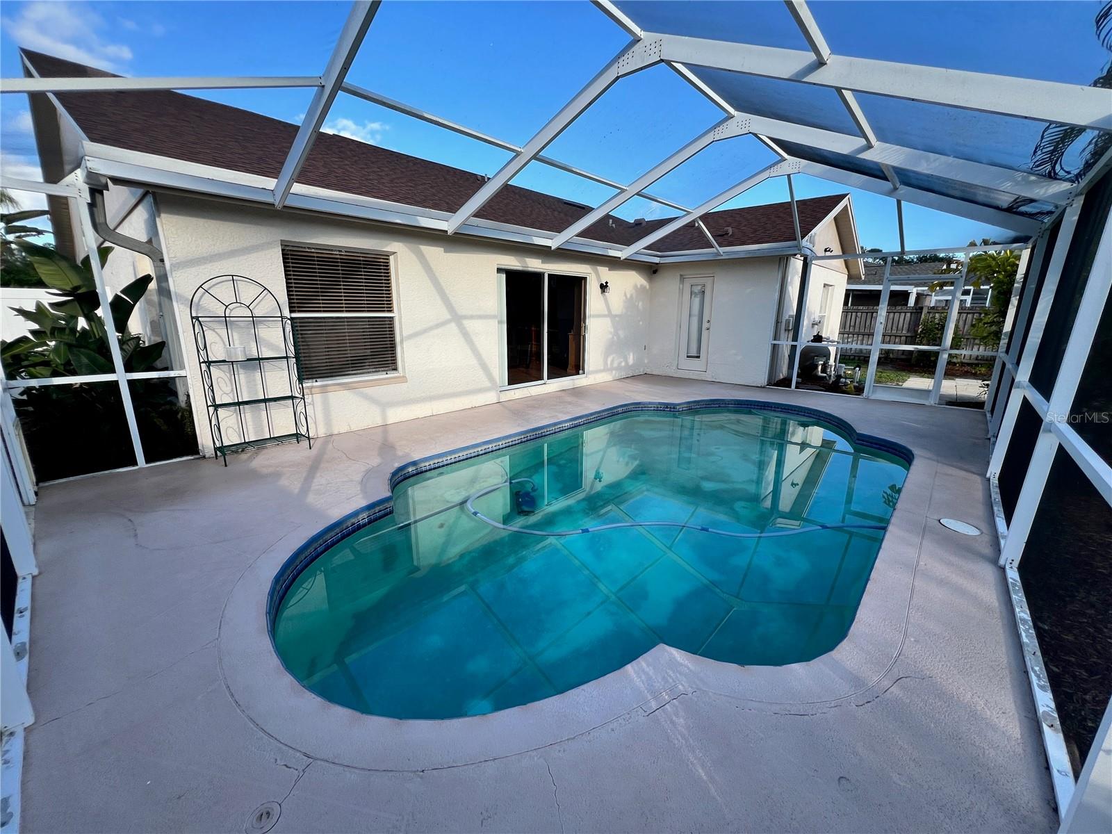Screened-in swimming pool.