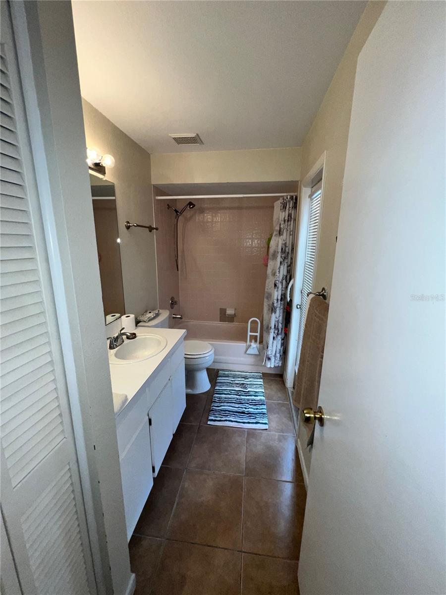 Hall bath. Linen closet is on near left.