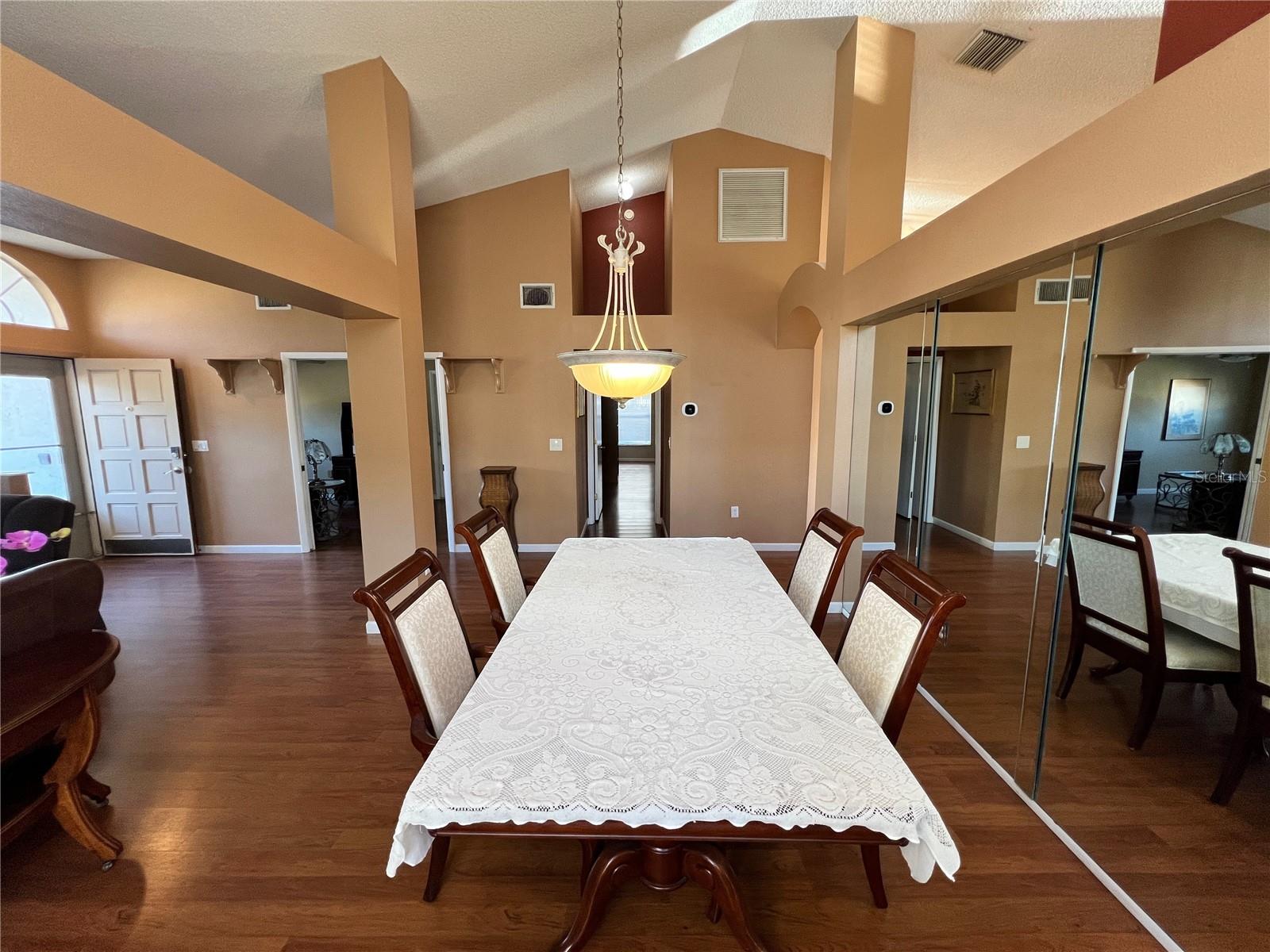 Formal dining area behind living room.