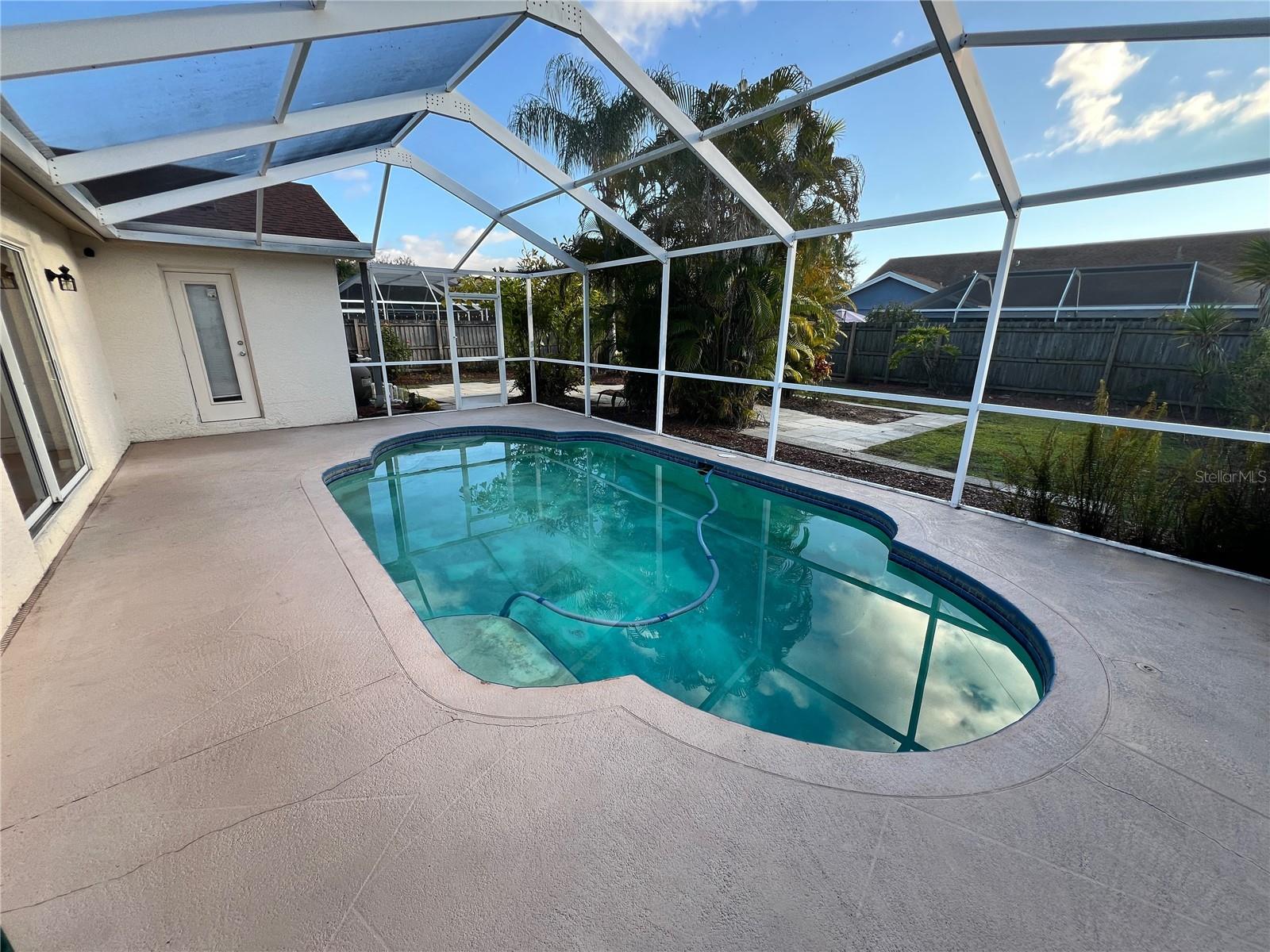 Screened-in swimming pool.