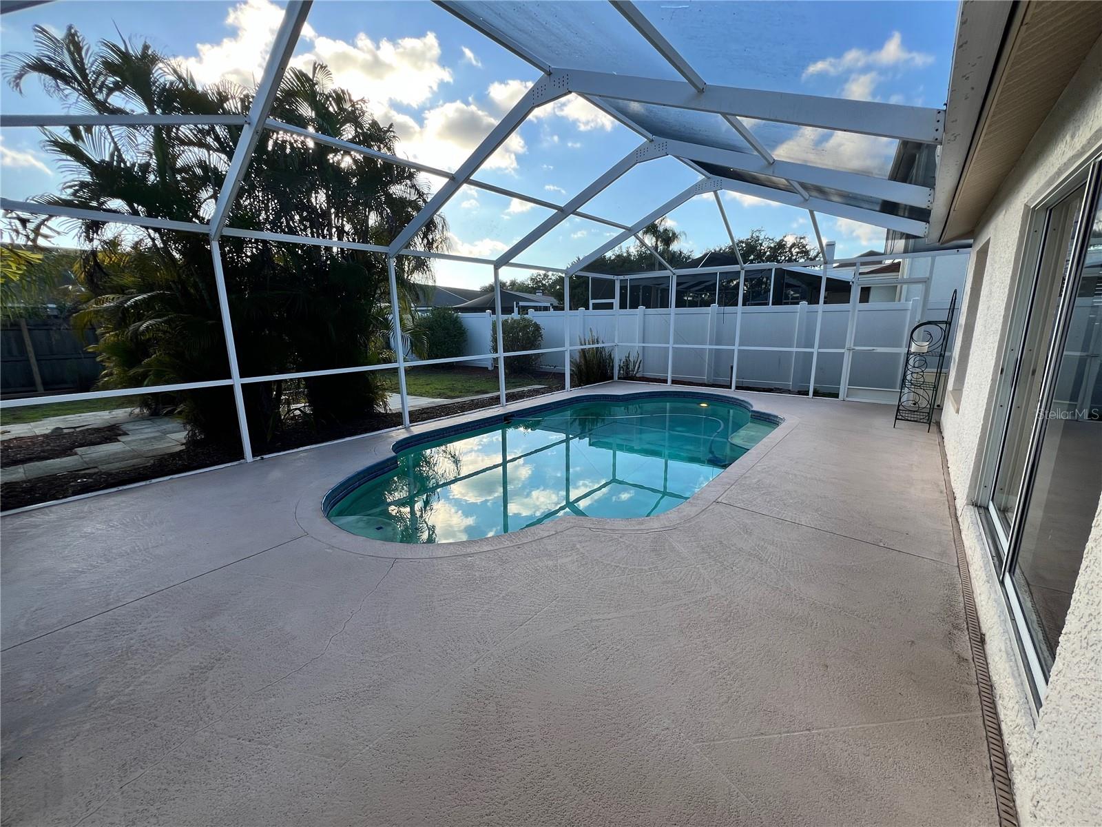 Screened-in swimming pool.