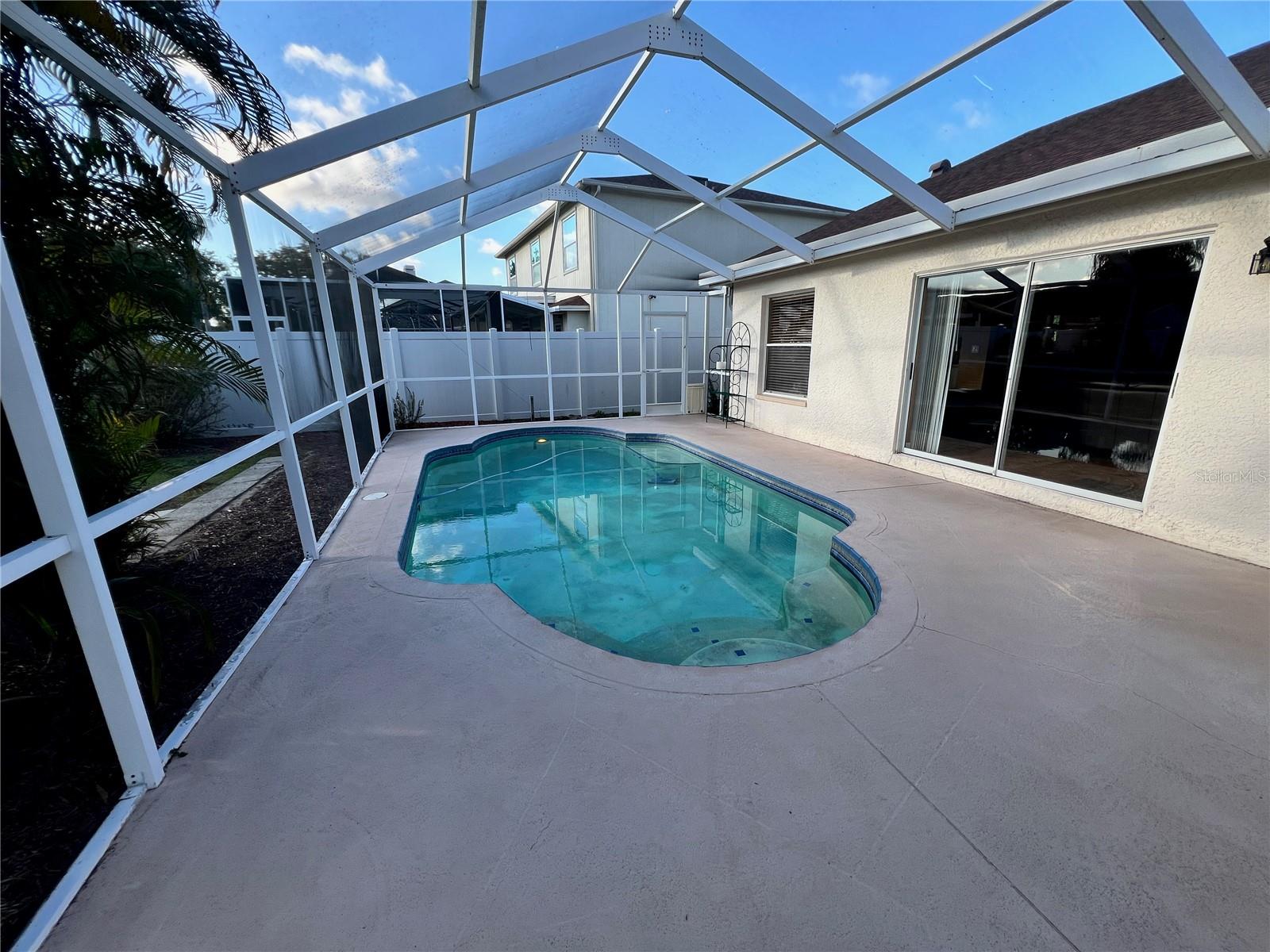 Screened-in swimming pool.