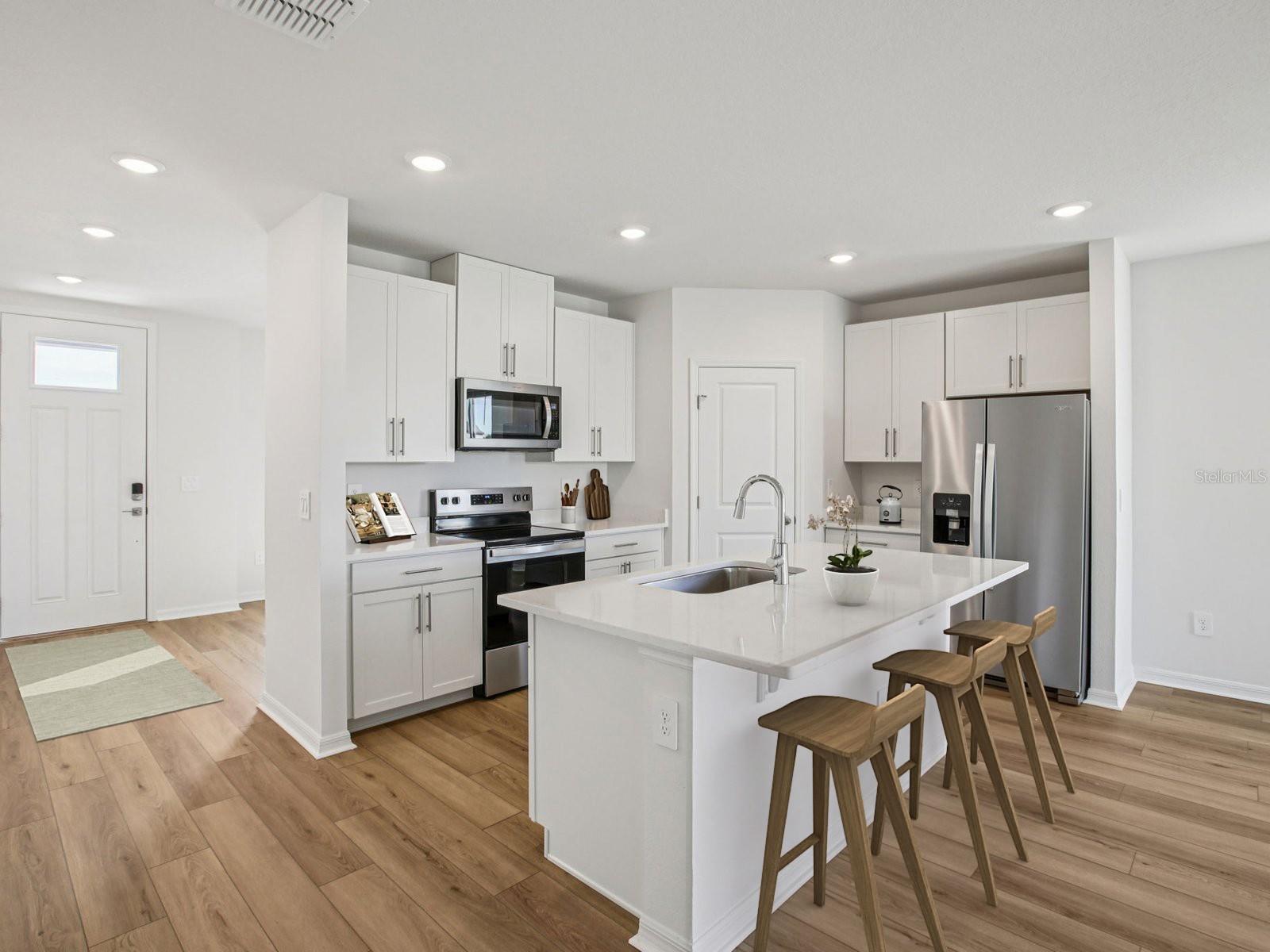 Interior photos are not of the actual home but are photos of the builder home with same floorplan with similar interior finishes and features. Photo uses virtual staging.