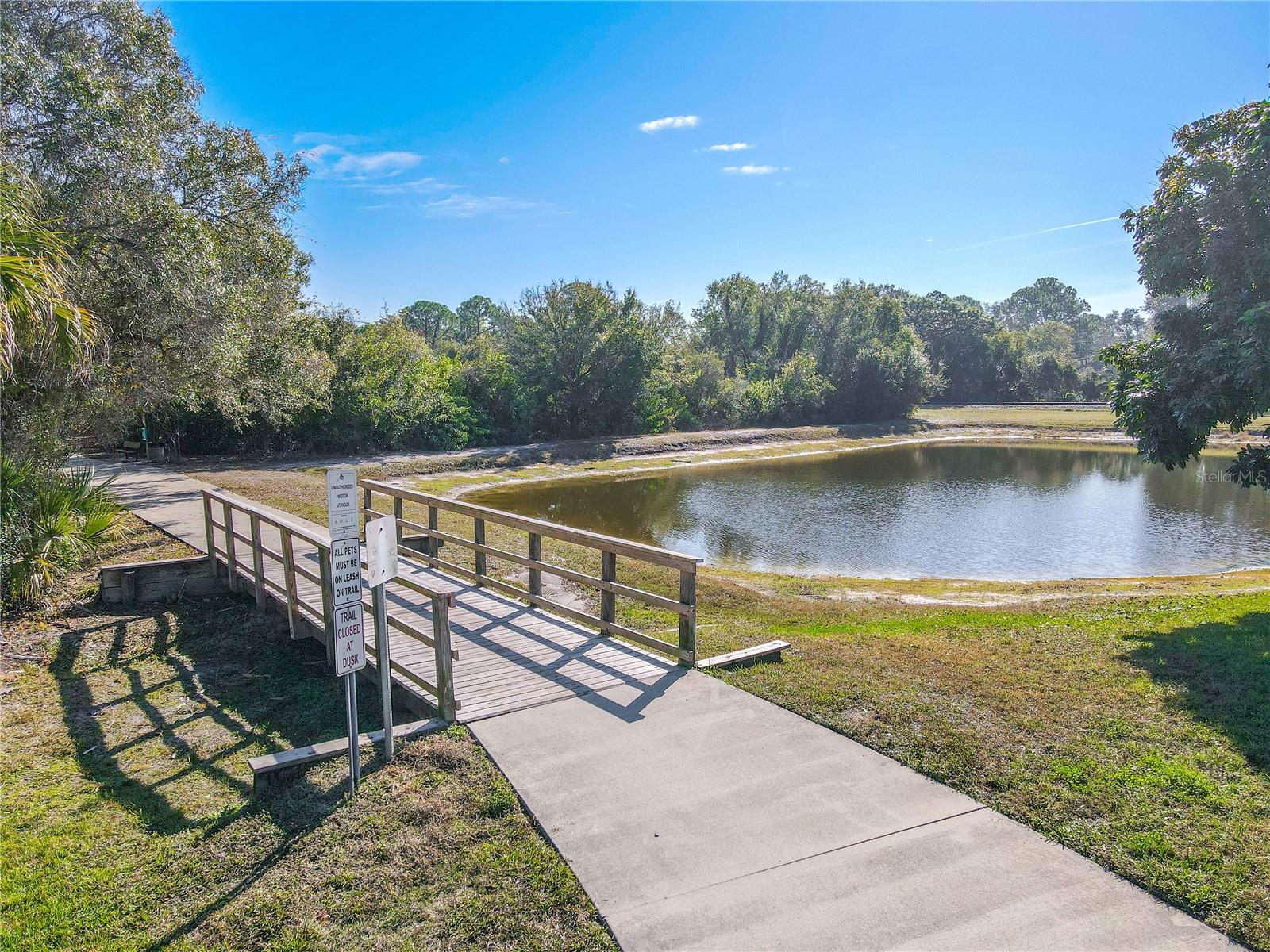 The Oldsmar Trail offers a beautiful paved route with a charming footbridge and tranquil pond views—perfect for biking, jogging, or a relaxing stroll.