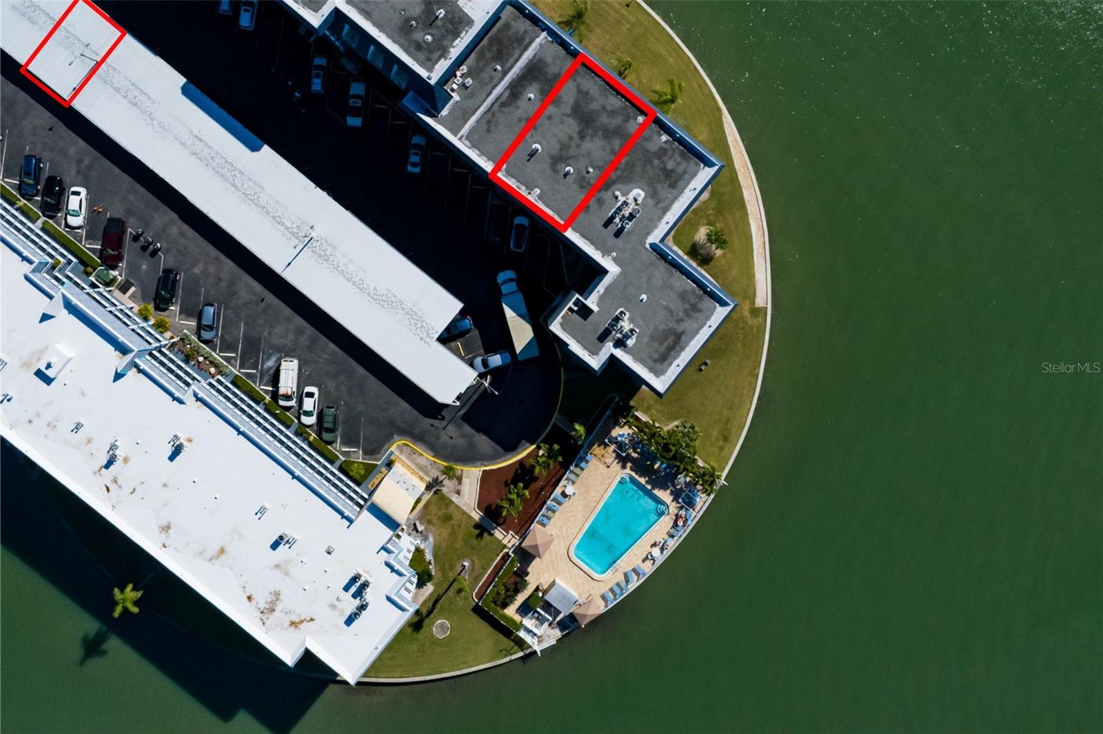 Waterfront pool & unit 411 w/Carport directly in front of bldg entrance.