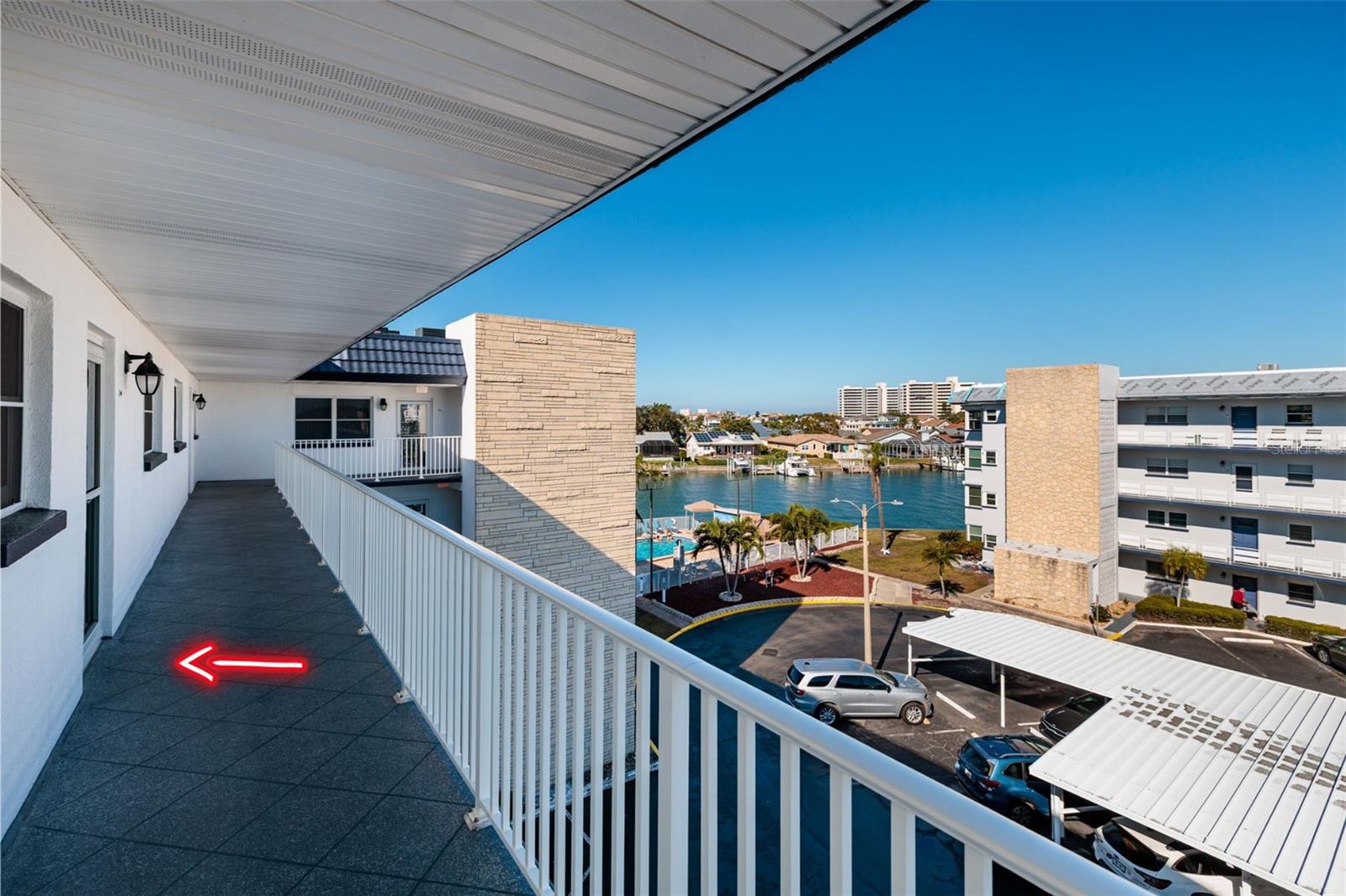 #411 on top floor & walkway also used for front porch. Storm door w/screen on impact front door.