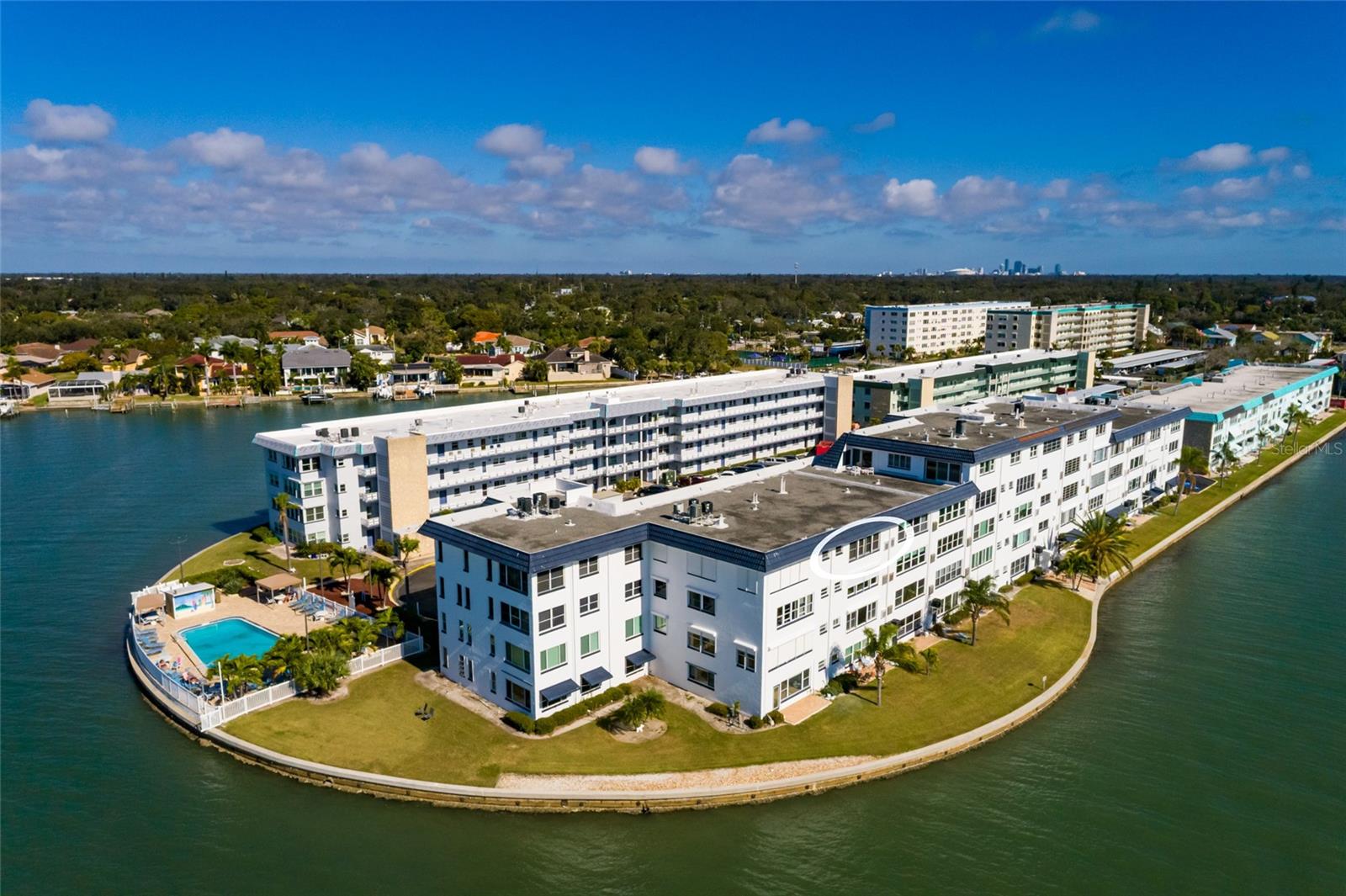 Unit 411 Florida room windows face South.