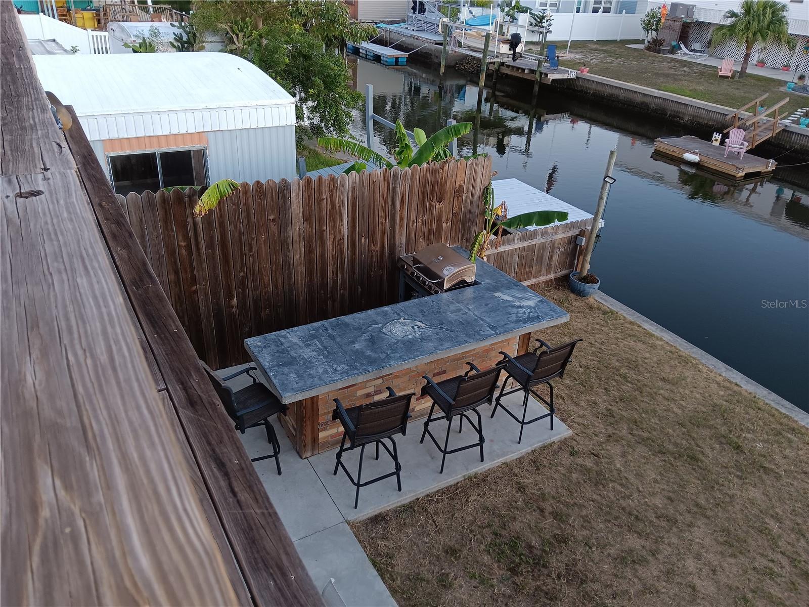 outdoor kitchen with dolphin carving on bar table