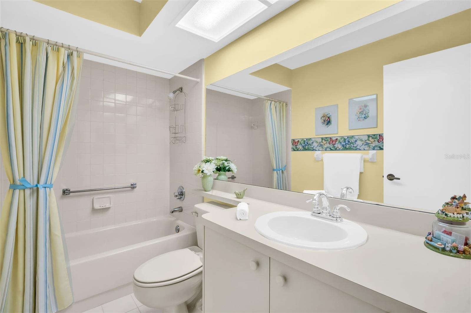 Hall bath with oversized vanity & tub/shower combo~