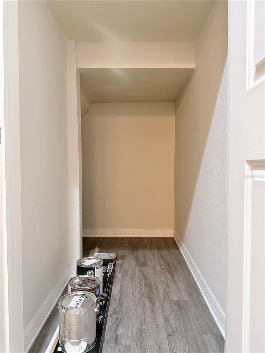 There's a huge walk-in closet under the stairs.