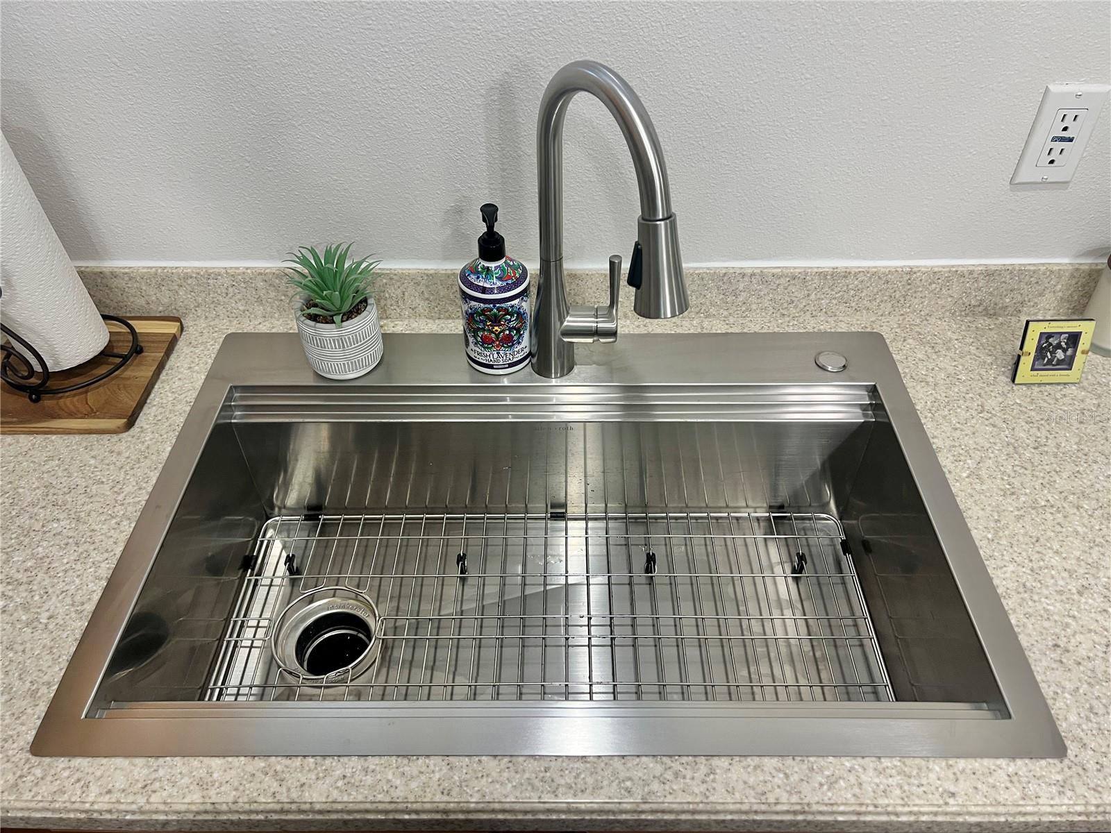 Brand new farm-style, stainless steel sink and faucet!  Drain insert included.
