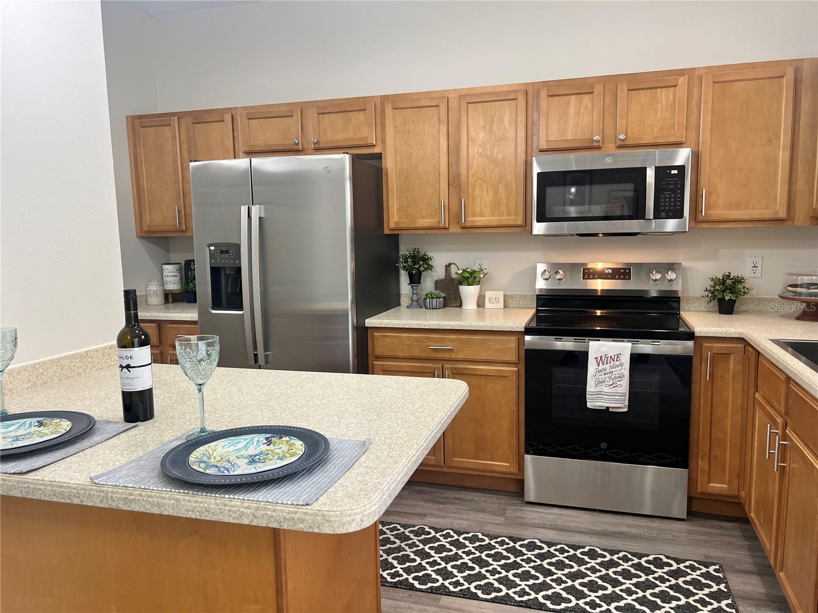 The countertops are a beautiful creamy Corian....no maintenance at all.