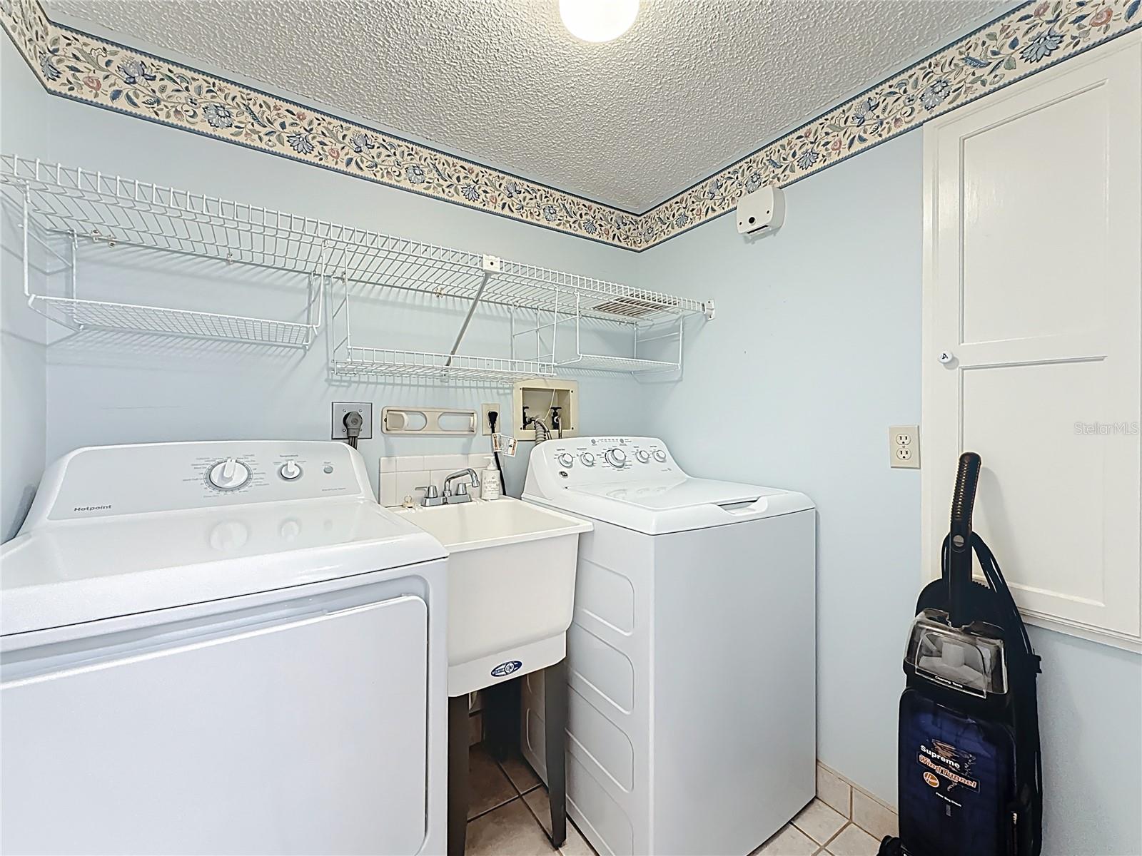 Enjoy a full size laundry with utility sink