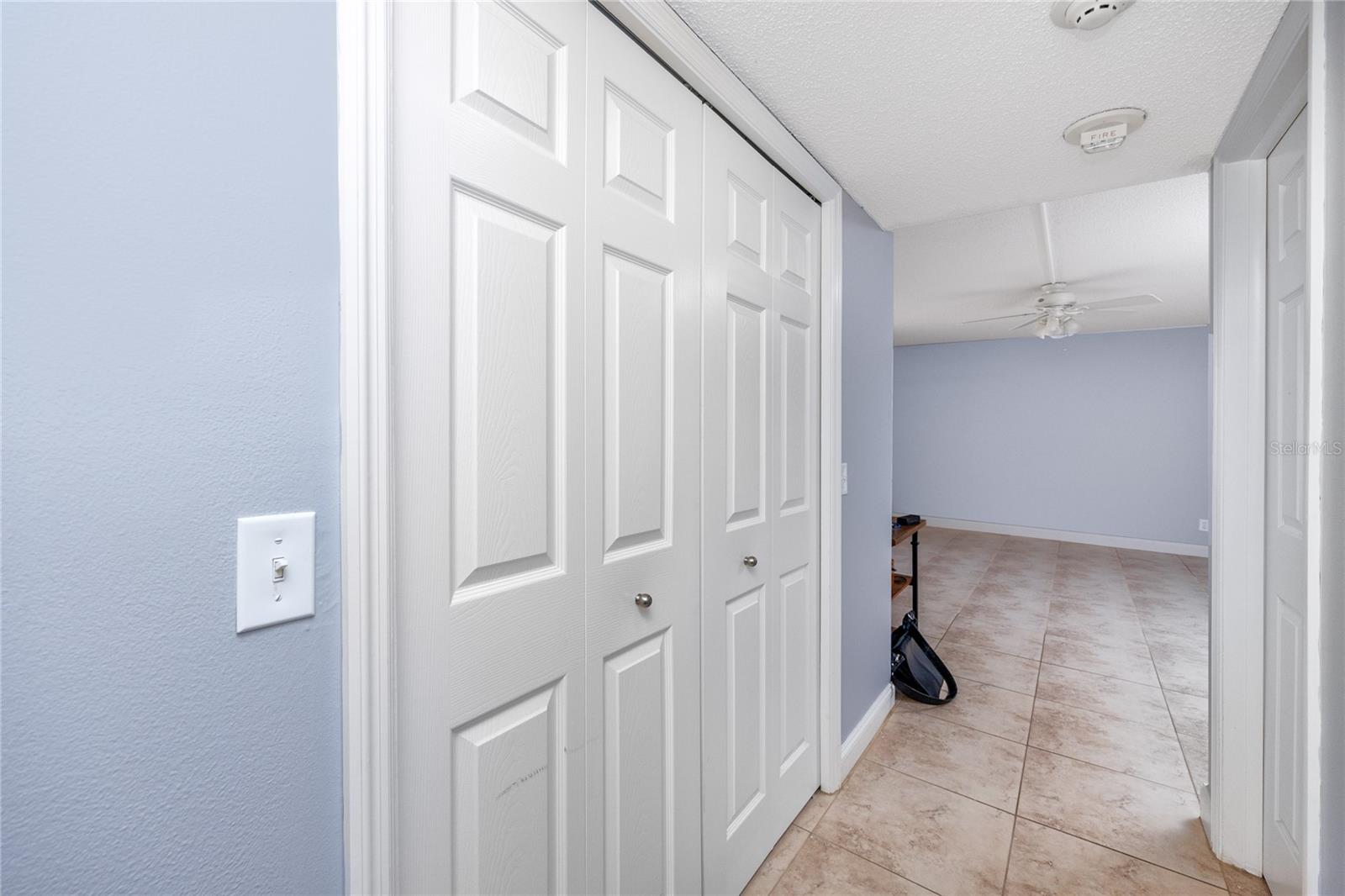 Entrance to the bedroom with large closet with built-ins to the left.