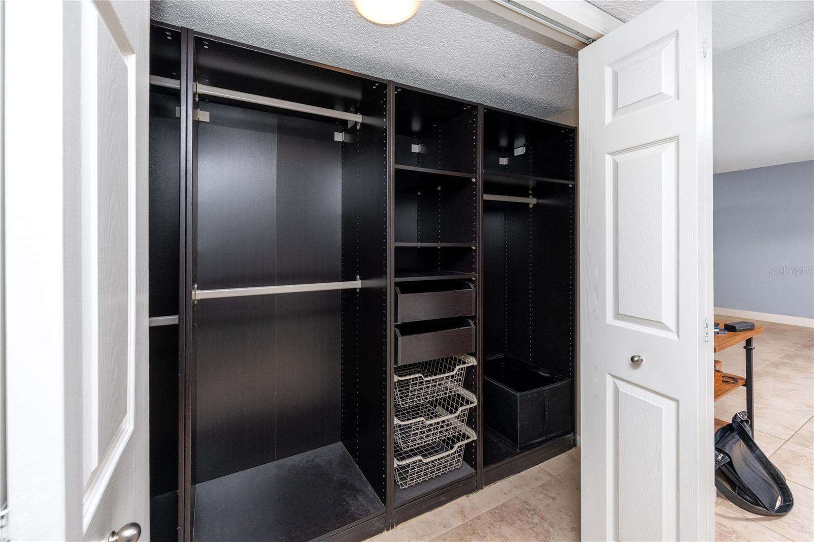 Built in closet organizer in bedroom.