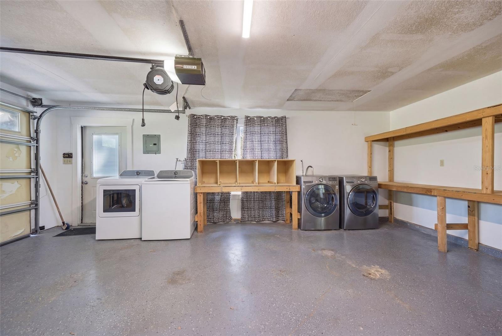 Double Laundry hookup and built in shelves in 3 car garage