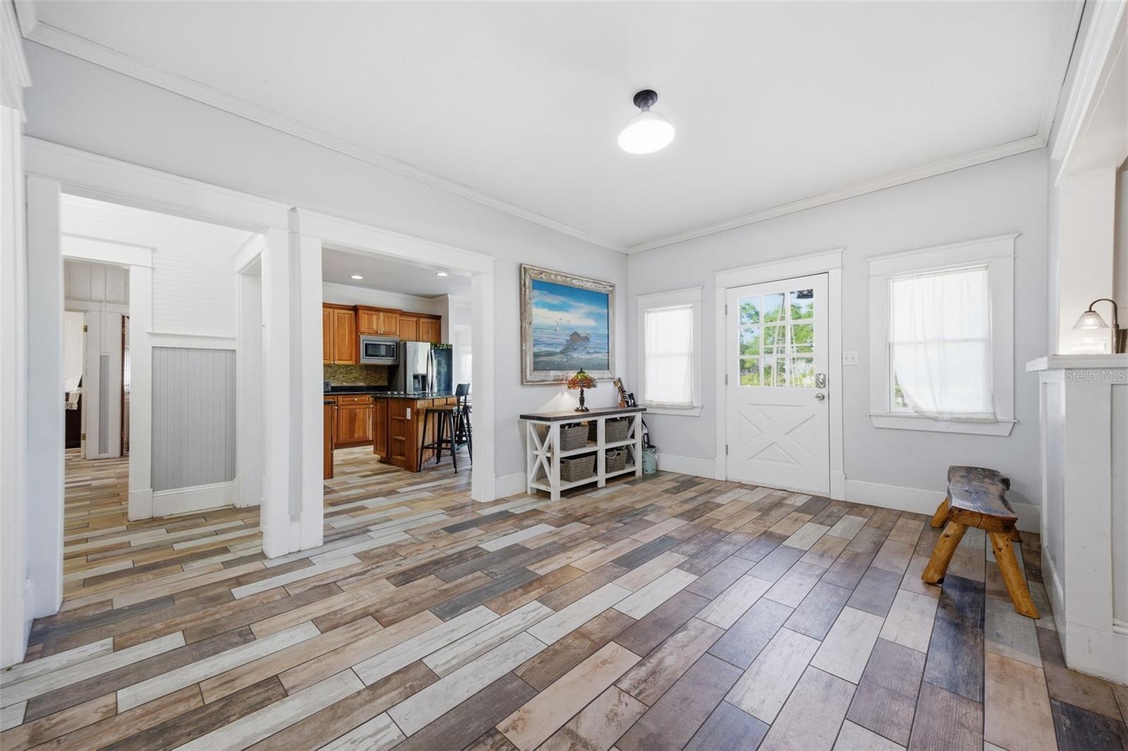 View of Front Door, Kitchen and hallway from the dining room
