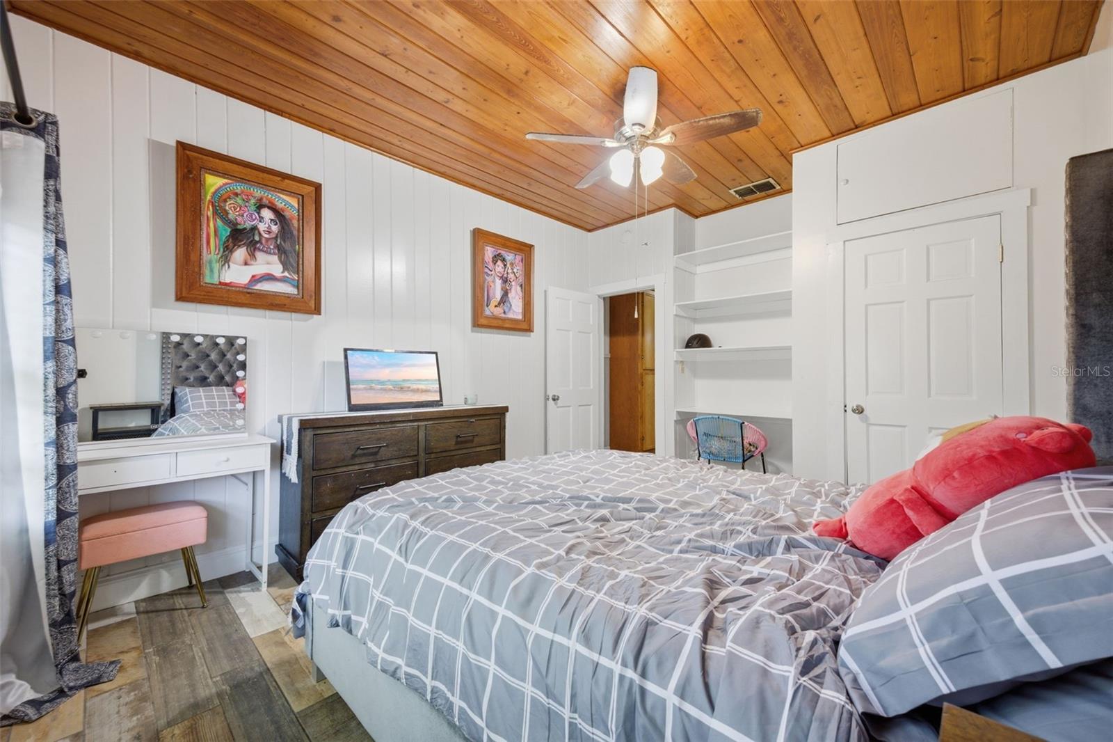 Bedroom 2-tongue and groove ceilings built in desk and walk in closet