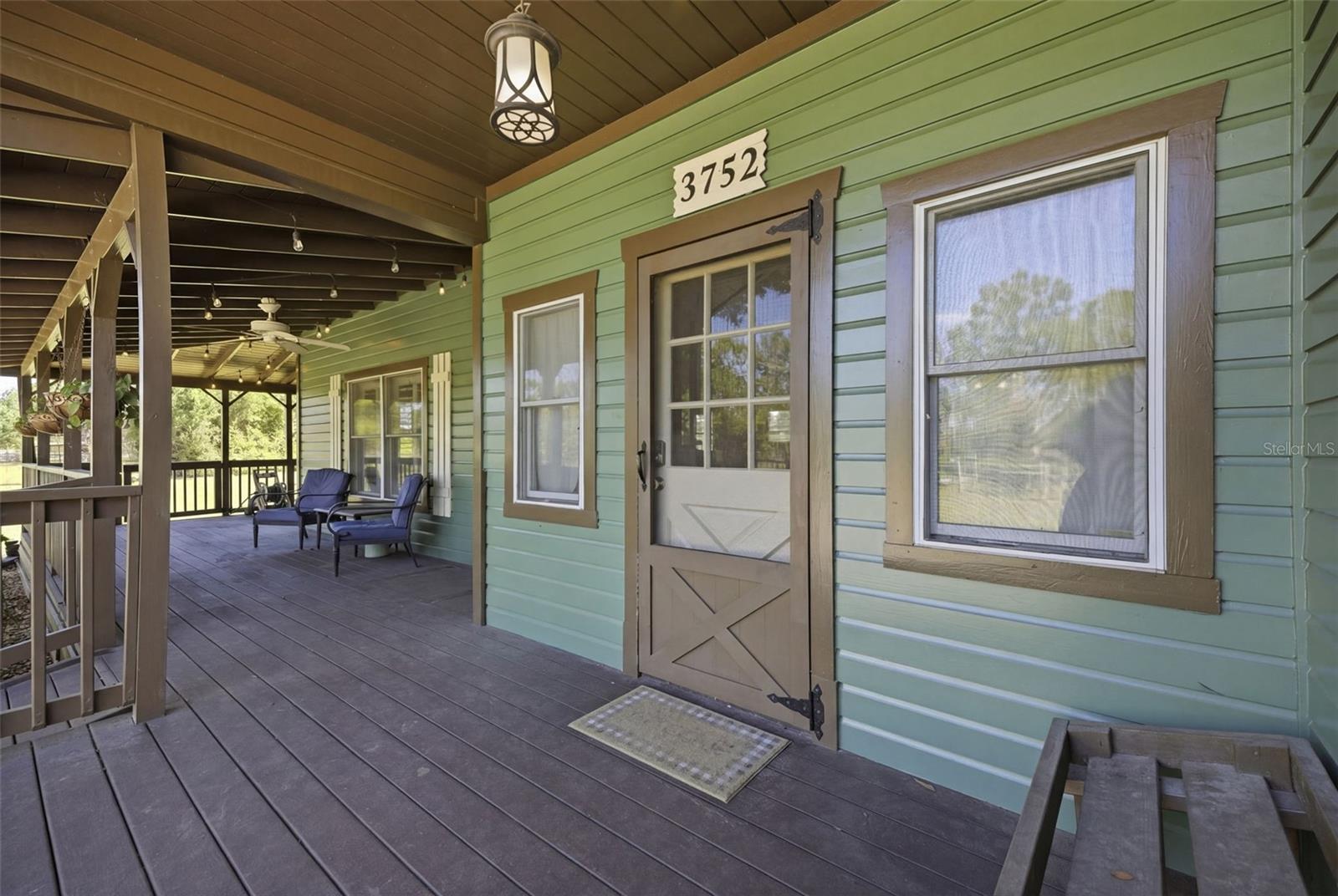 Front door and the 3/4 wrap around porch with