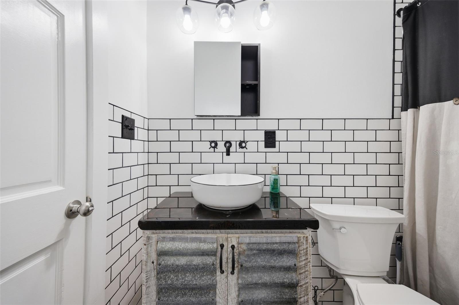 Bathroom 2-modern farmhouse with sleek vessel sink