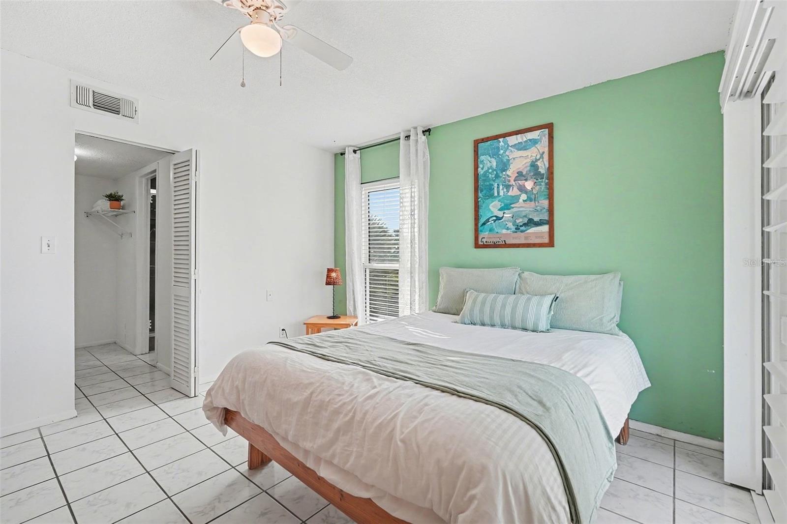 Walk in closet and ensuite in the primary bedroom.