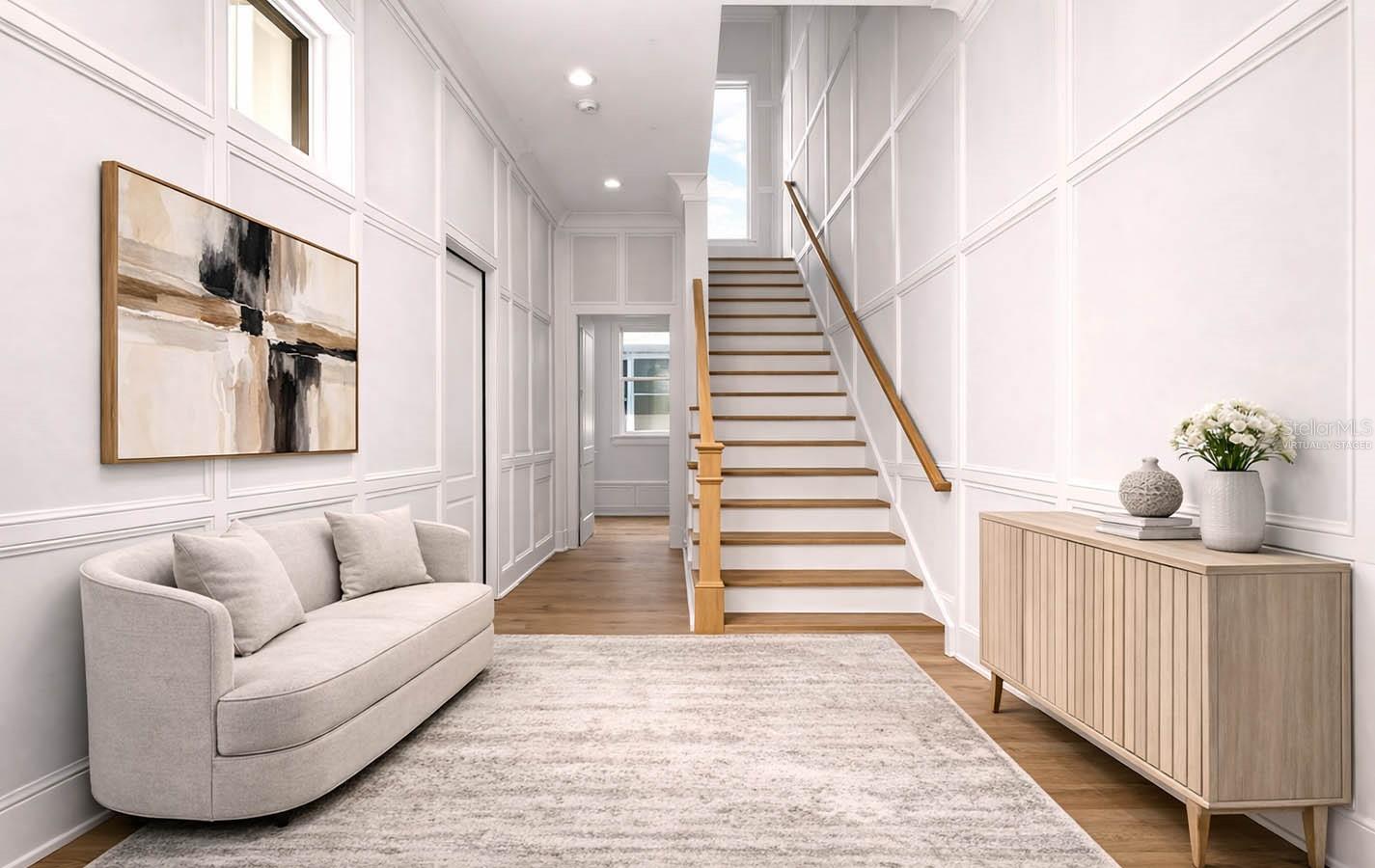 ENTRANCE GALLERY LAYERED IN CUSTOM MILLWORK  Virtually staged