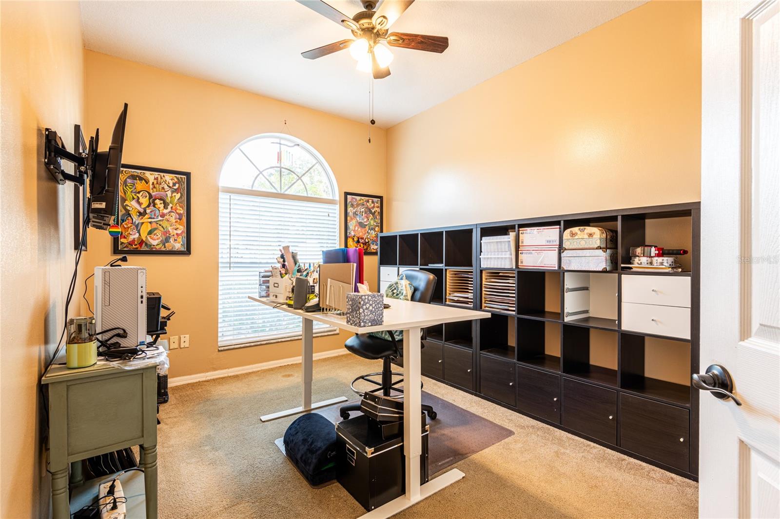 Third bedroom with built in closet and view to front of home