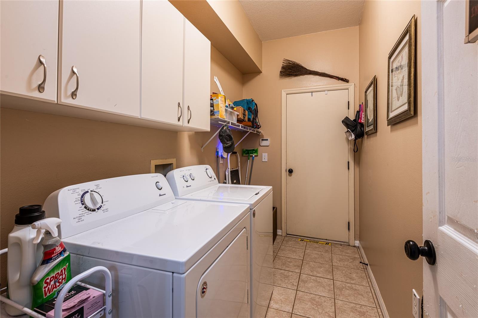 Laundry room - hook up available for a sink - entrance door to garage
