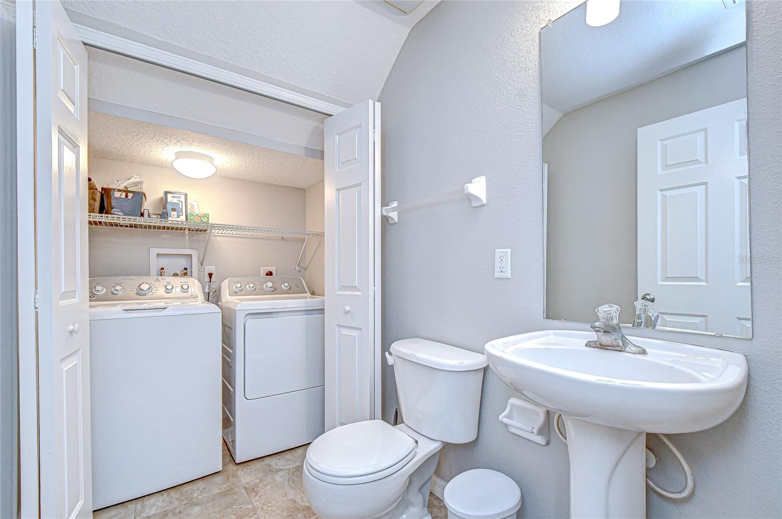 Half bath downstairs with laundry closet!