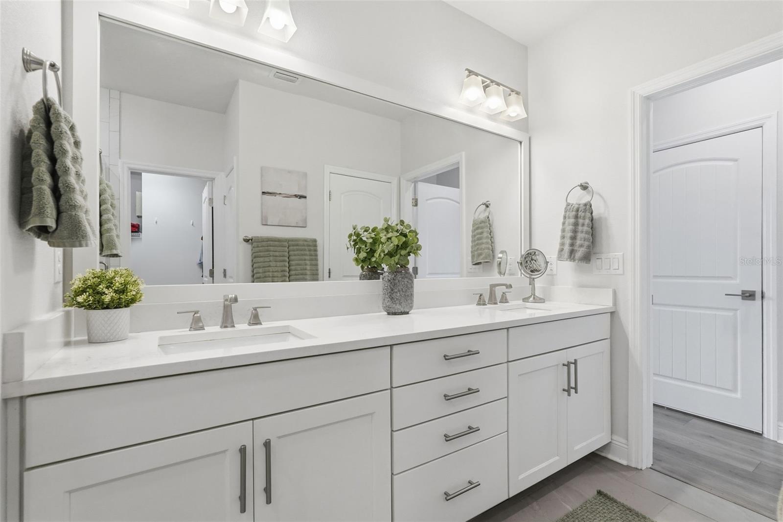 Master bathroom offers dual sinks.