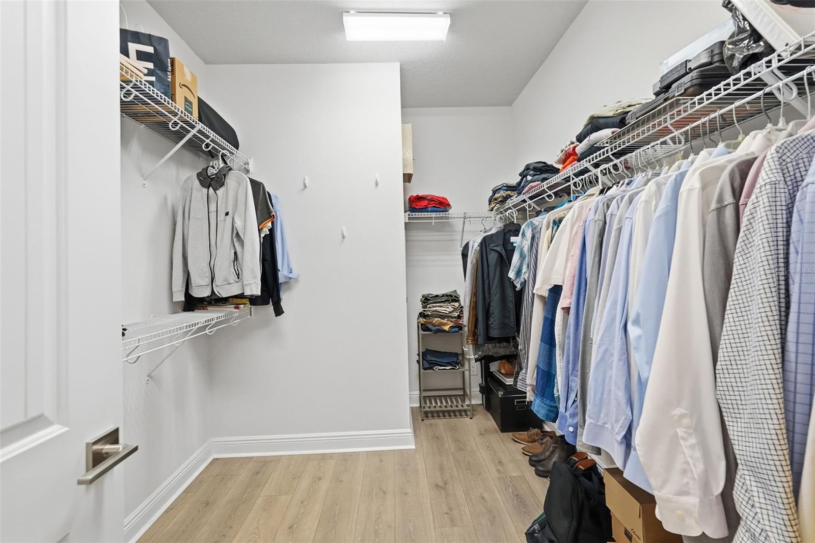 Primary master bedroom suite walk-in closet.