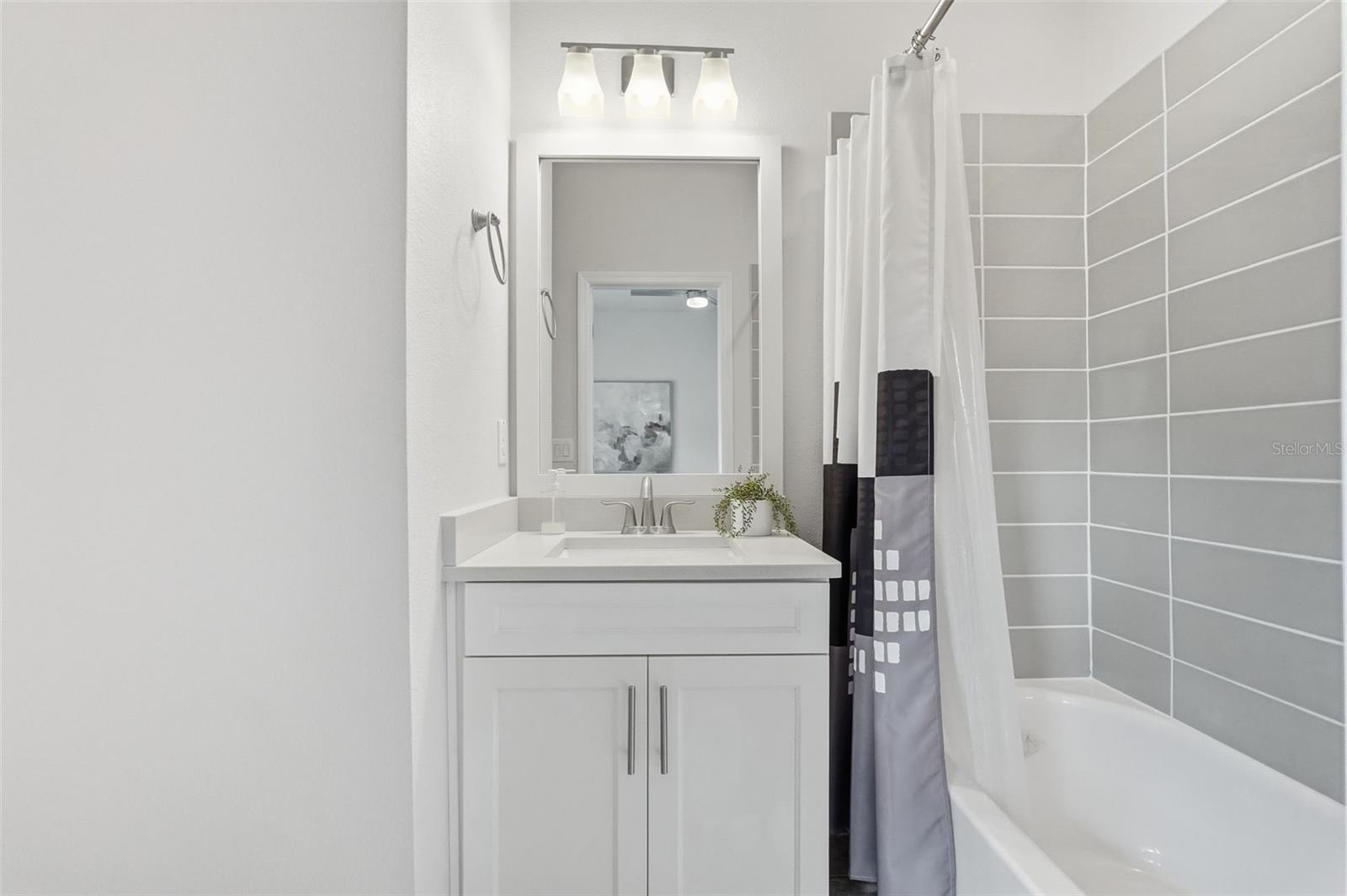 Bathroom of the 3rd floor bedroom suite offers a shower/tub combo (not the primary master suite).