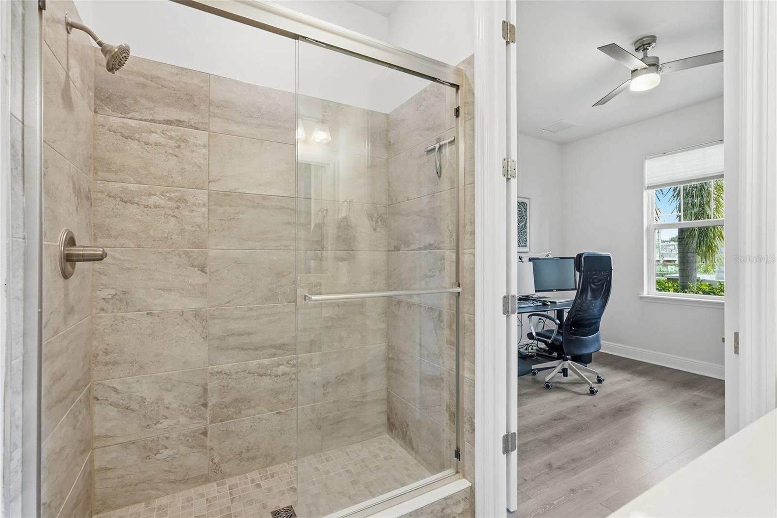 First floor full bathroom offers a walk-in shower.