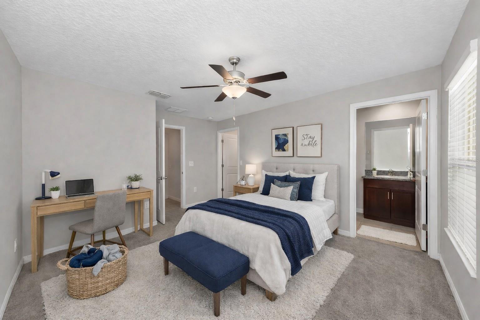 Suite bedroom with private bath and walk-in closet