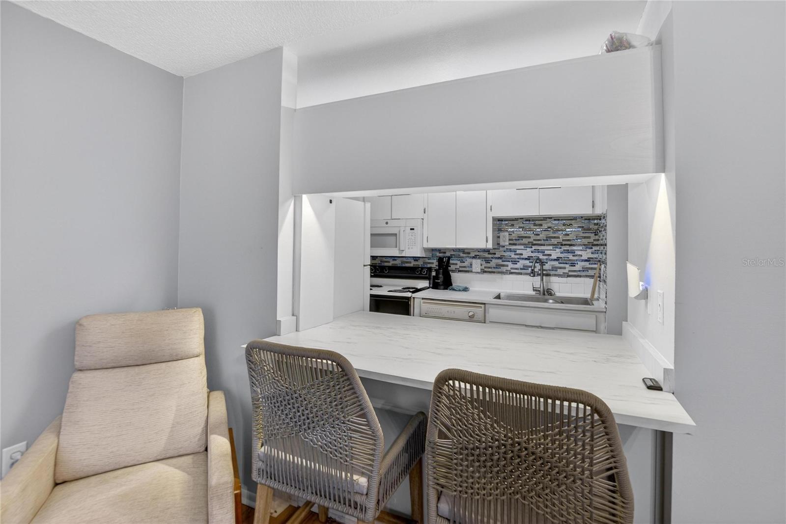 Kitchen Pass through Bar Seating Area