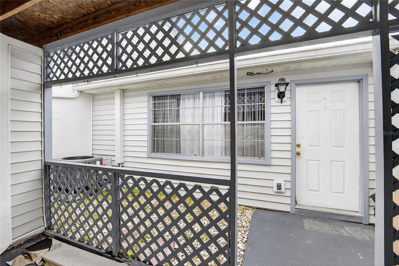 Front Door and small  Courtyard view from Garage