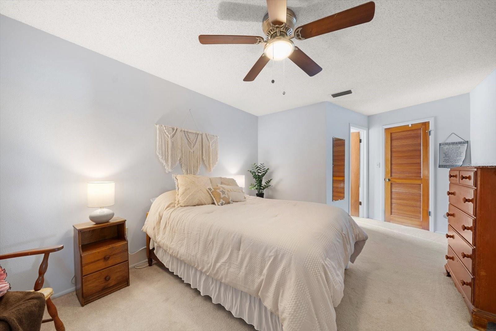 Primary bedroom with en-suite bath and walk-in closet