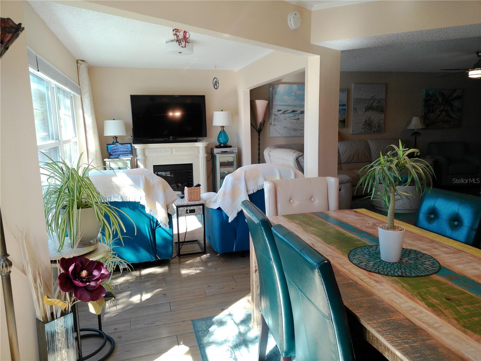 View from Dinette to the Sitting area with Fireplace and Television