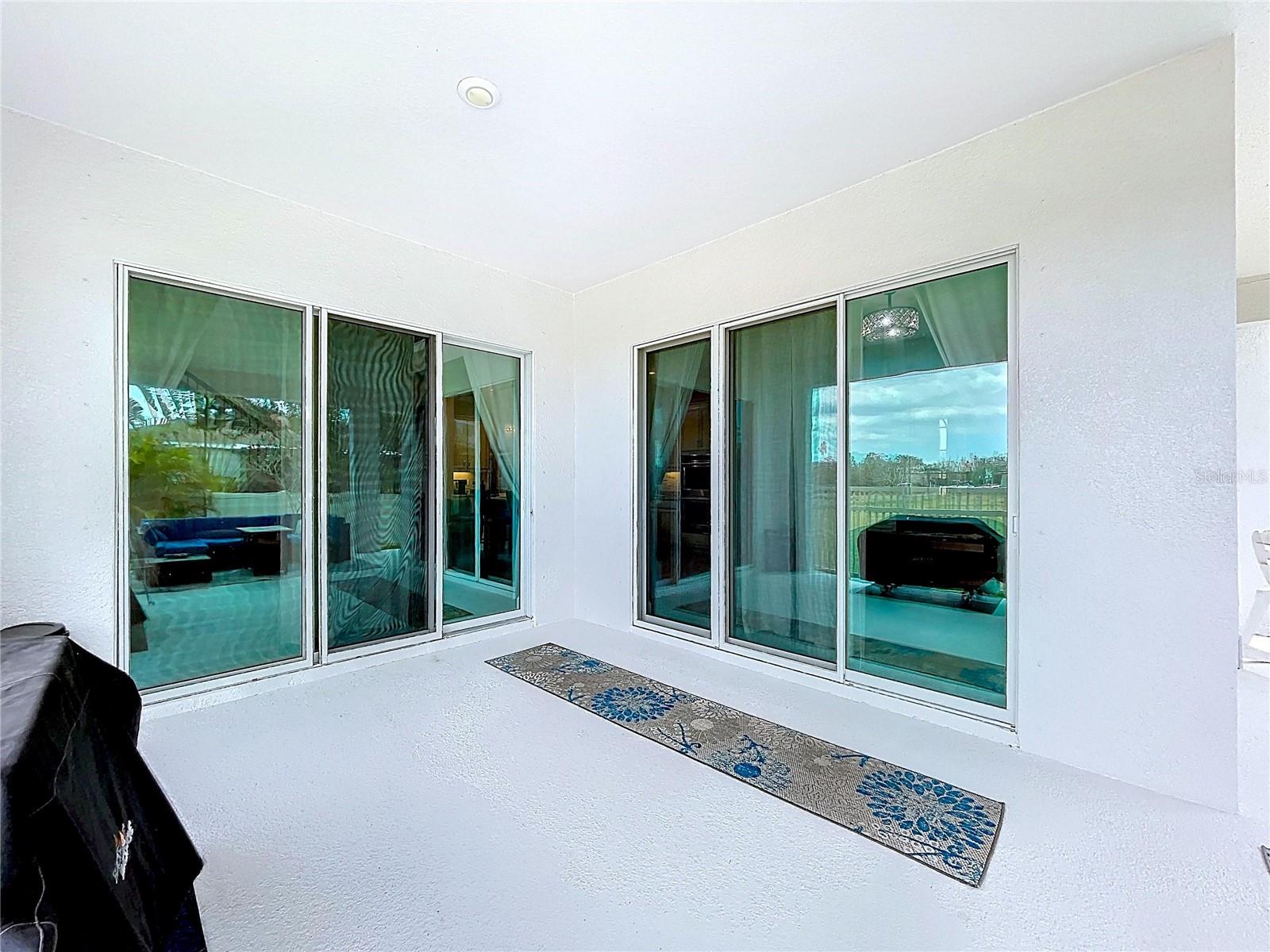 OUTSIDE LANAI WITH 2 SETS OF SLIDING DOORS
