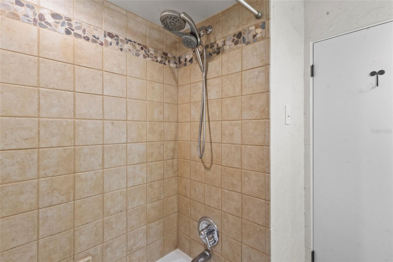 Updated Bathroom – Bathroom with granite vanity, modern fixtures, and natural light.
