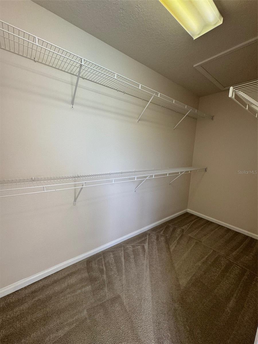 Huge walk-in closet in owner's retreat.