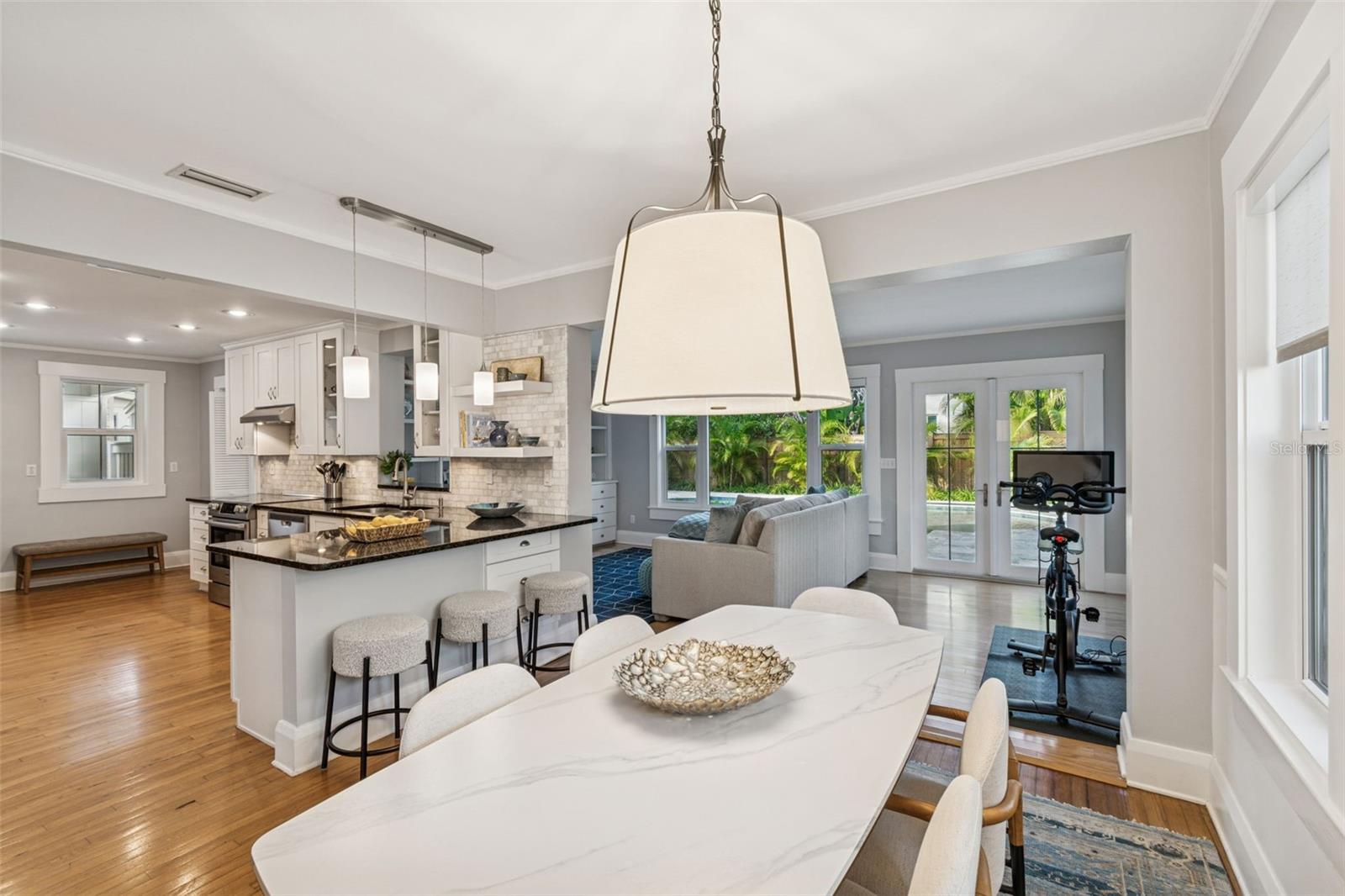 Dining area with view of pool and kitchen