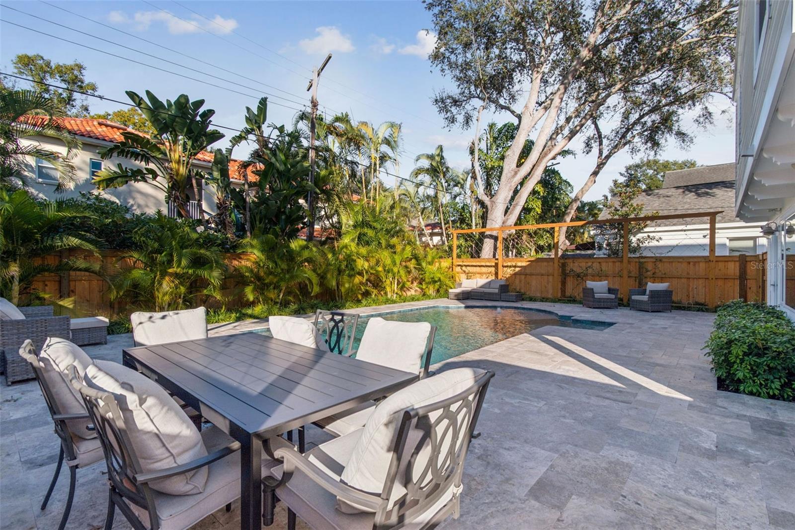 All new travertine pool deck