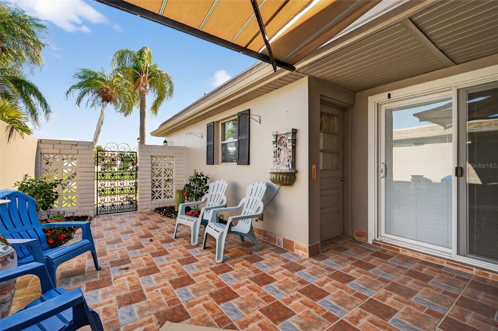 Sliding doors to 2nd Bedroom, detached garage door to the left.