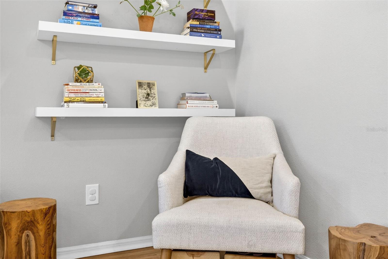 A reading nook highlights the corner of the room.