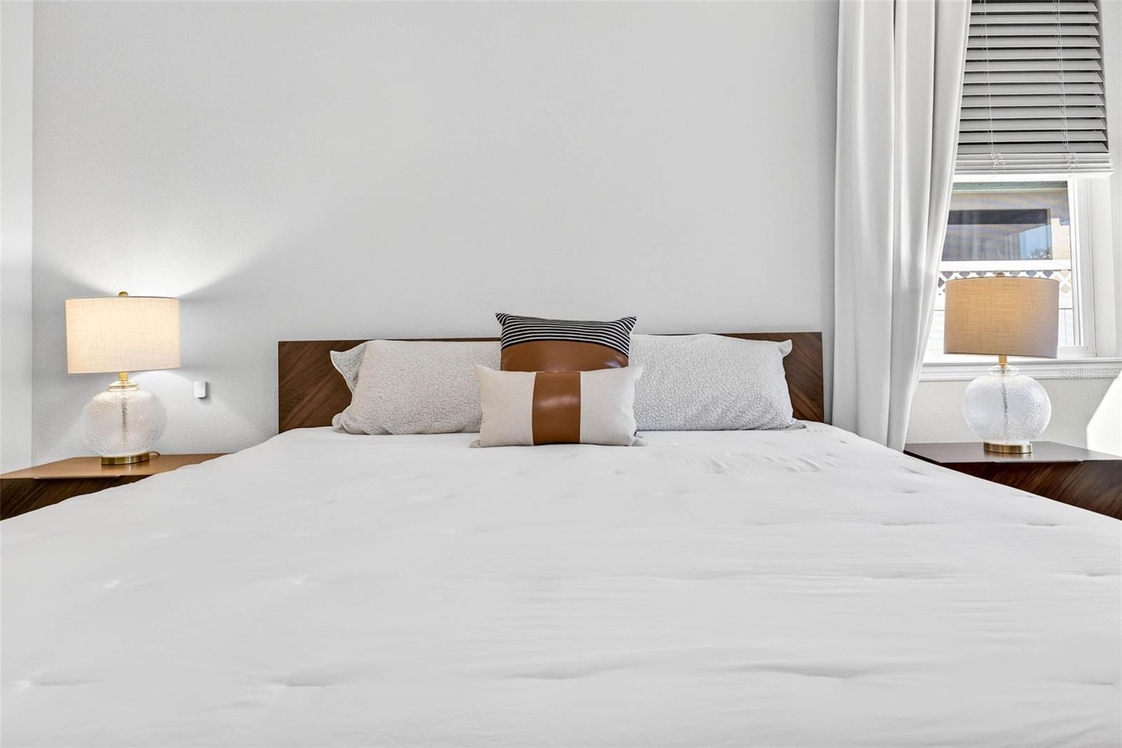 The primary suite fits a king bed + room for additional desk or dressers.